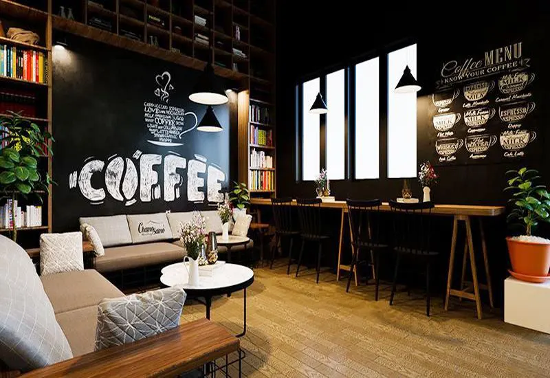 trang trí quán cafe với màu trắng đen làm chủ đạo vẽ lên tường